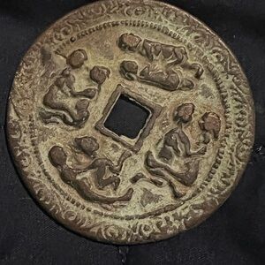 Antique Bronze Coin with Intricate Design